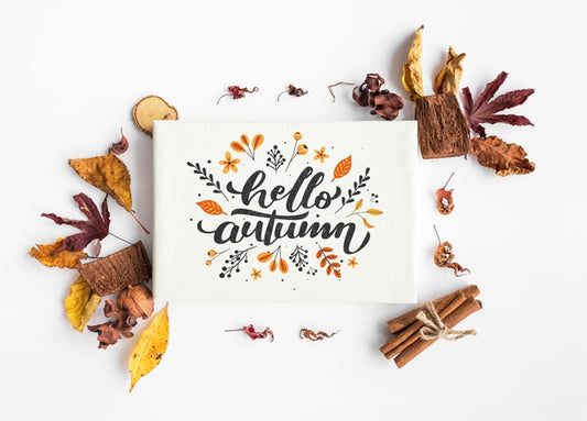 Free Top View Of Hello Autumn Paper And Colorful Leaves Psd