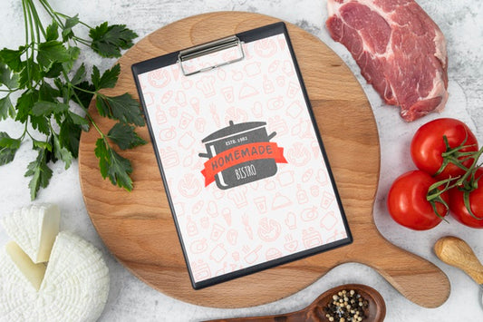 Free Top View Of Meat With Menu And Tomatoes Psd