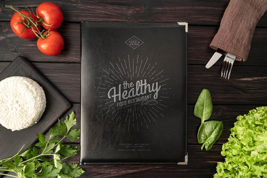 Free Top View Of Menu With Tomatoes And Cutlery Psd