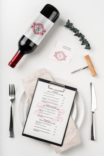 Free Top View Of Menu With Wine Bottle And Cutlery Psd