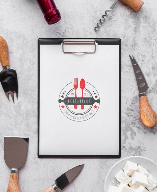 Free Top View Of Menu With Wine Bottle And Utensils Psd