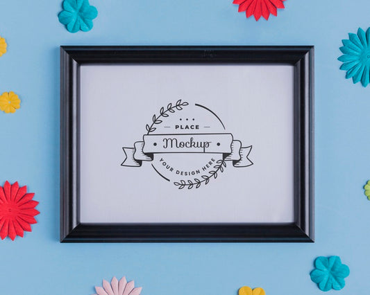 Free Top View Of Mock-Up Frame With Multicolored Paper Decoration Psd