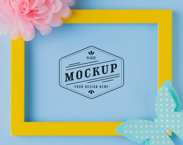 Free Top View Of Mock-Up Frame With Paper Butterflies And Flowers Psd