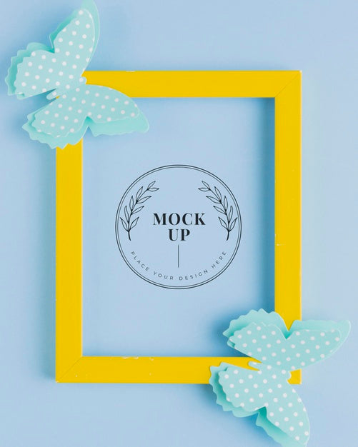 Free Top View Of Mock-Up Frame With Paper Butterflies Psd