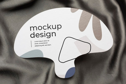 Free Top View Of Mock-Up Hand Fan On Black Textile Psd