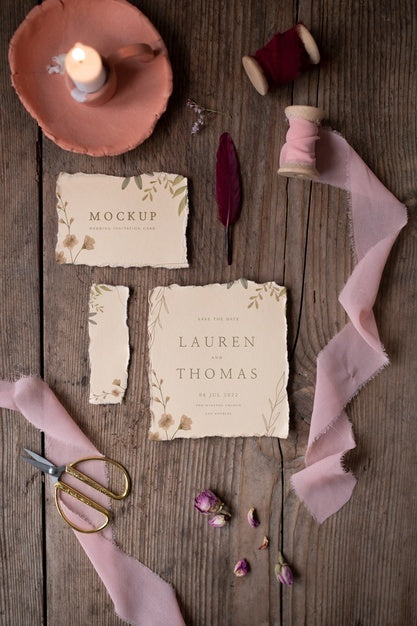Free Top View Of Mock-Up Rustic Paper Wedding Invitation With Leaves And Flowers Psd