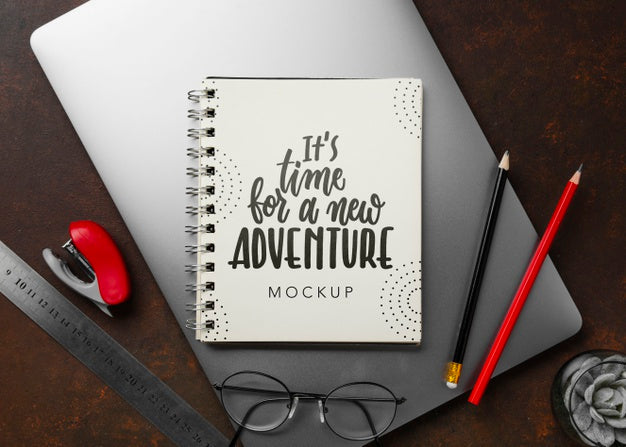 Free Top View Of Notebook On Laptop With Pencils And Glasses At Desk Psd