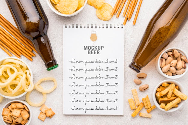 Free Top View Of Notebook With Assortment Of Snacks And Beer Bottles Psd