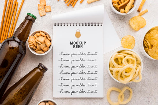 Free Top View Of Notebook With Beer Bottles And Assortment Of Snacks Psd