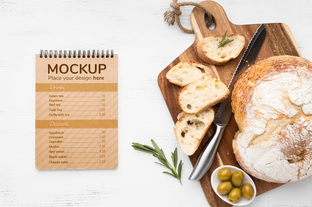 Free Top View Of Notebook With Bread And Olives With Knife Psd