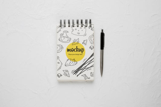 Free Top View Of Notebook With Cheese Design And Pen Psd