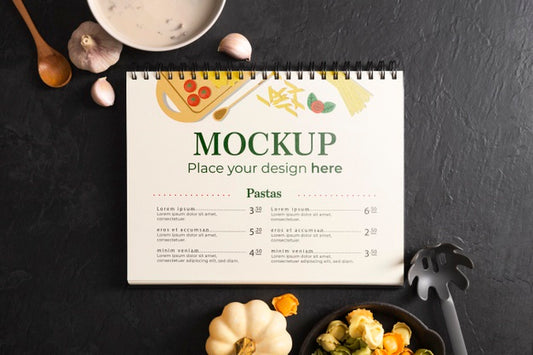 Free Top View Of Notebook With Christmas Dishes And Garlic Psd