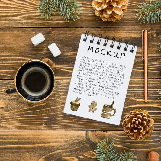 Free Top View Of Notebook With Coffee And Spruce Branches Psd