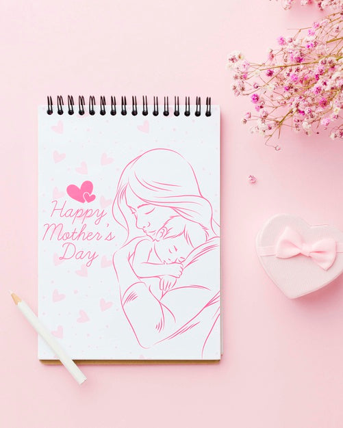 Free Top View Of Notebook With Flowers And Present Psd