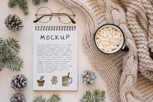 Free Top View Of Notebook With Marshmallows And Pine Cones Psd