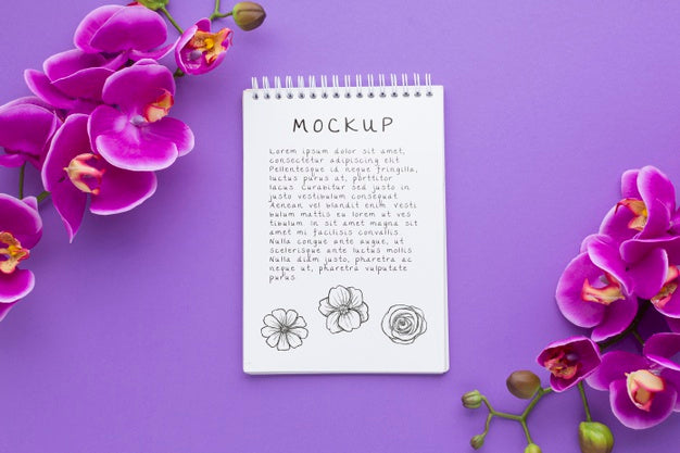 Free Top View Of Notebook With Orchid Psd