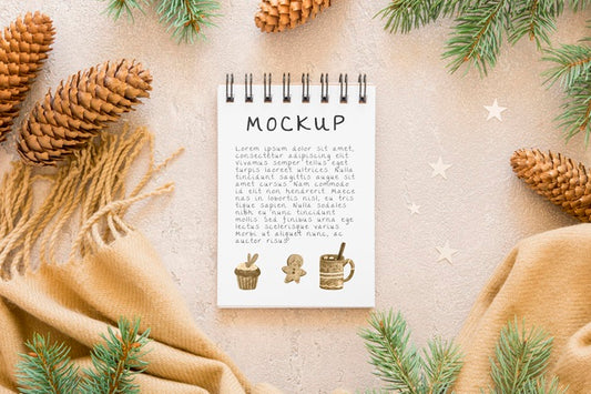 Free Top View Of Notebook With Pine Cones And Scarf Psd