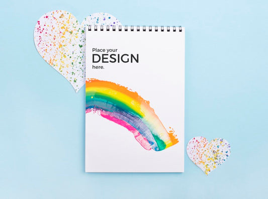 Free Top View Of Notebook With Rainbow And Heart Psd