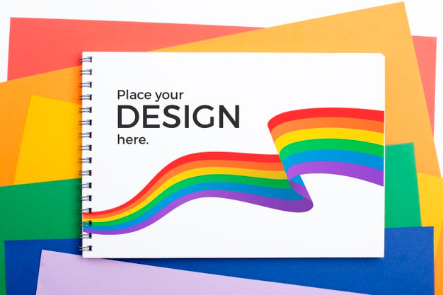Free Top View Of Notebook With Rainbow Colors Psd
