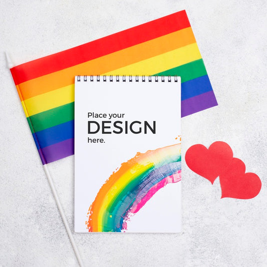 Free Top View Of Notebook With Rainbow Flag And Hearts Psd