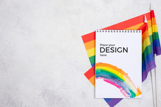 Free Top View Of Notebook With Rainbow Flags Psd