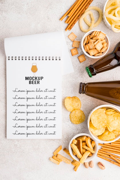 Free Top View Of Notebook With Selection Of Snacks And Beer Bottles Psd