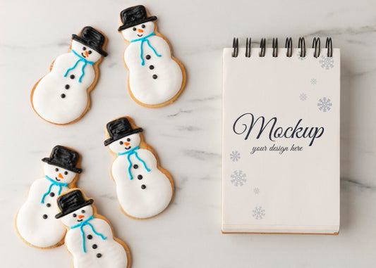 Free Top View Of Notebook With Snowman Cookies Psd