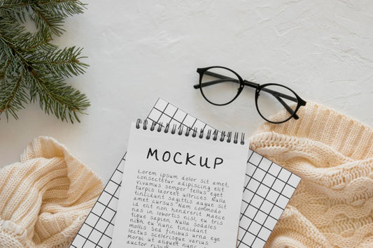 Free Top View Of Notebook With Spruce Branch And Glasses Psd