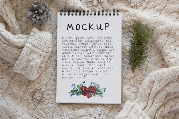 Free Top View Of Notebook With Spruce Branch And Sweater Psd