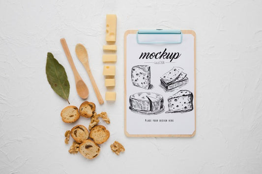 Free Top View Of Notepad With Cheese And Spoons Psd