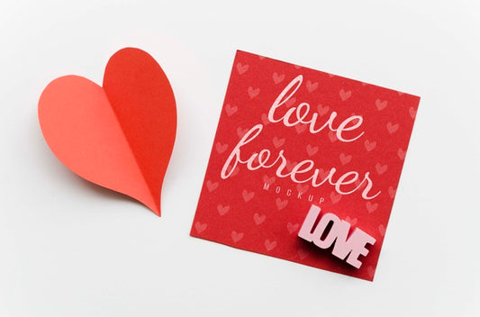 Free Top View Of Paper Heart With Card Psd