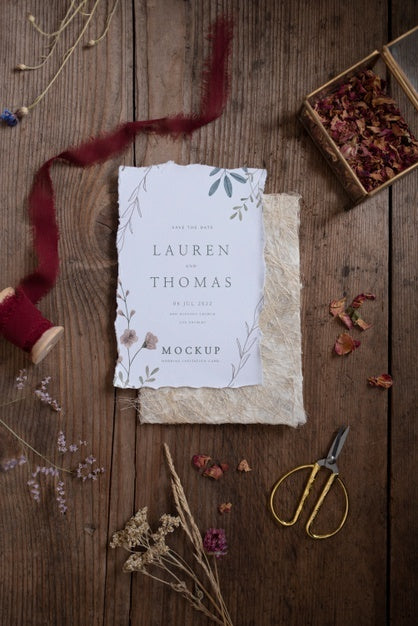 Free Top View Of Paper Mock-Up Rustic Wedding Invitation With Leaves And Flowers Psd