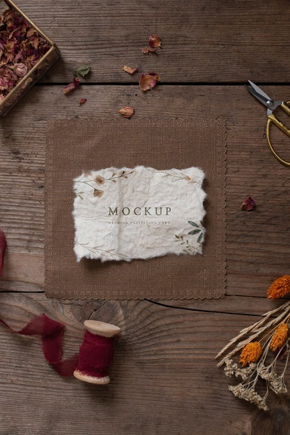 Free Top View Of Paper Mock-Up Rustic Wedding Invitation With Leaves And Flowers Psd