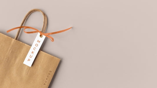 Free Top View Of Paper Shopping Bag Mock-Up With Paper Tag Psd