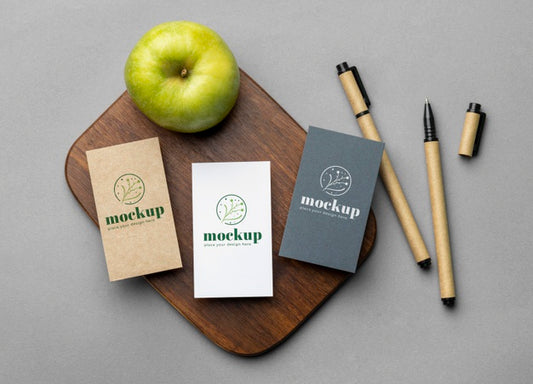 Free Top View Of Paper Stationery With Apple And Pencils Psd