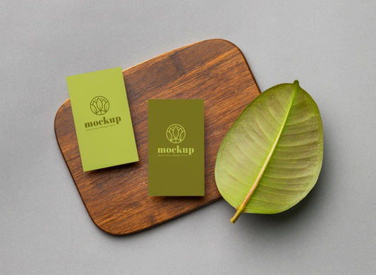 Free Top View Of Paper Stationery With Leaves Psd