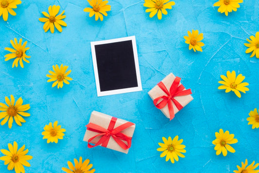 Free Top View Of Photo And Gifts With Yellow Chamomile Psd