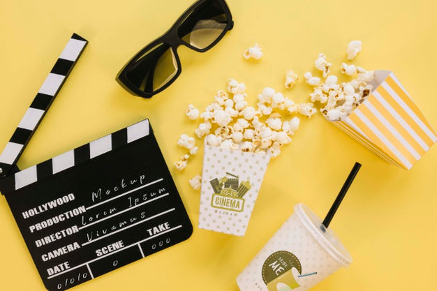 Free Top View Of Popcorn Cup With Clapperboard And Glasses Psd