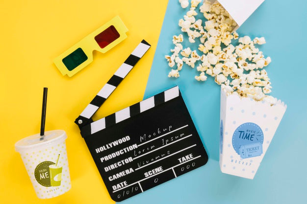 Free Top View Of Popcorn Cup With Clapperboard And Soda Psd