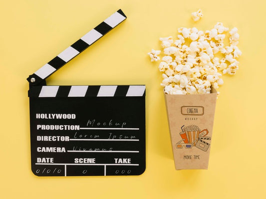 Free Top View Of Popcorn Cup With Clapperboard Psd