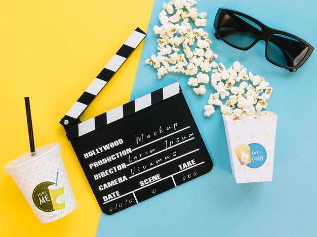 Free Top View Of Popcorn Cup With Glasses And Clapperboard Psd