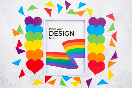 Free Top View Of Rainbow Colored Hearts With Flag And Paper Shapes Psd