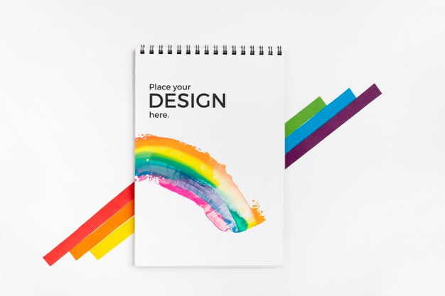 Free Top View Of Rainbow Colors With Notebook Psd