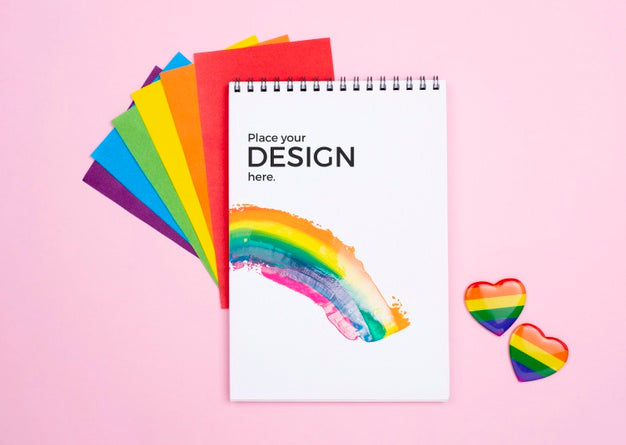 Free Top View Of Rainbow Hearts And Notebook Psd