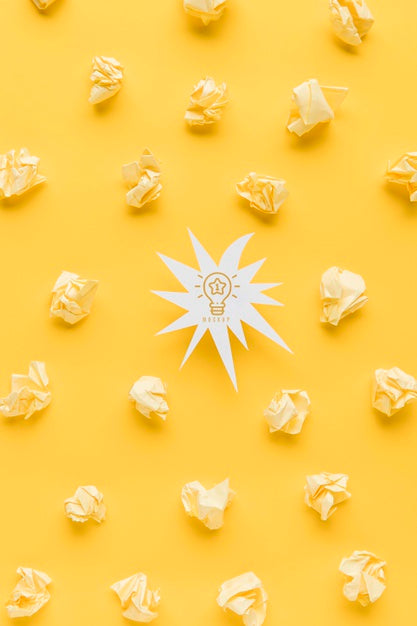 Free Top View Of Shape With Idea Light Bulb And Crinkled Paper Psd