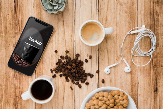Free Top View Of Smartphone With Coffee Beans And Cup Of Tea Psd