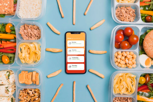 Free Top View Of Smartphone With Planned Meals Psd