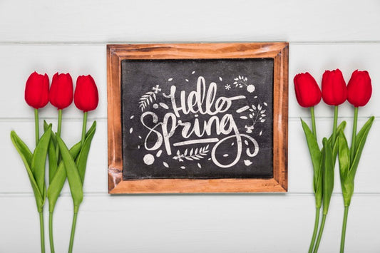 Free Top View Of Spring Red Tulips And Blackboard Psd