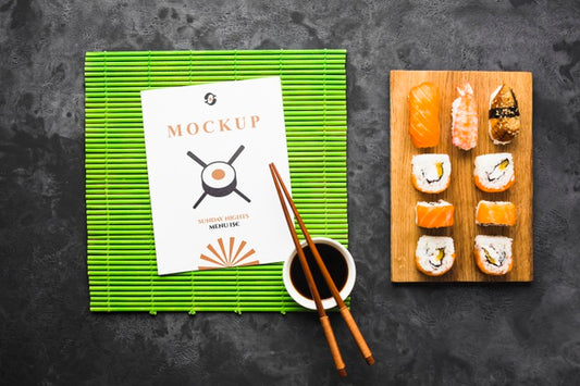 Free Top View Of Sushi On Chopping Board With Chopsticks And Soy Sauce Psd