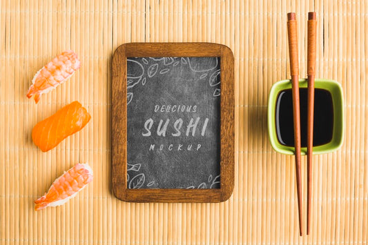Free Top View Of Sushi With Chopsticks And Blackboard Psd
